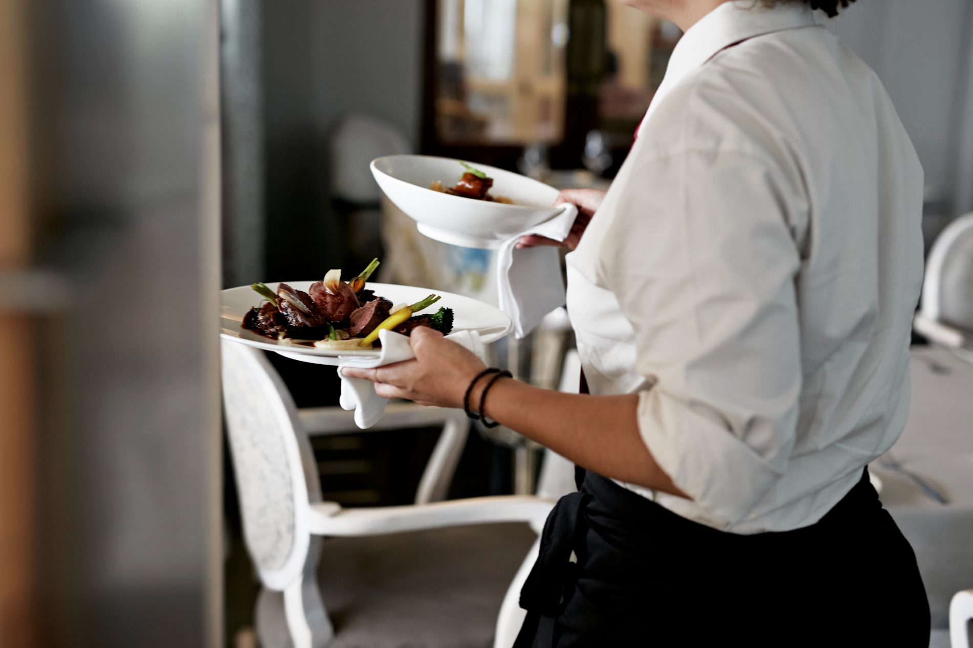 Plated dishes carried to service