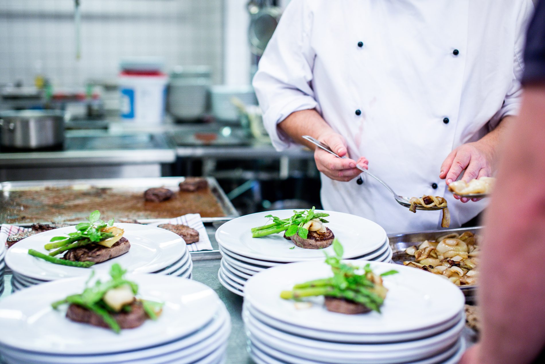 Chefs plating to order in the production kitchen